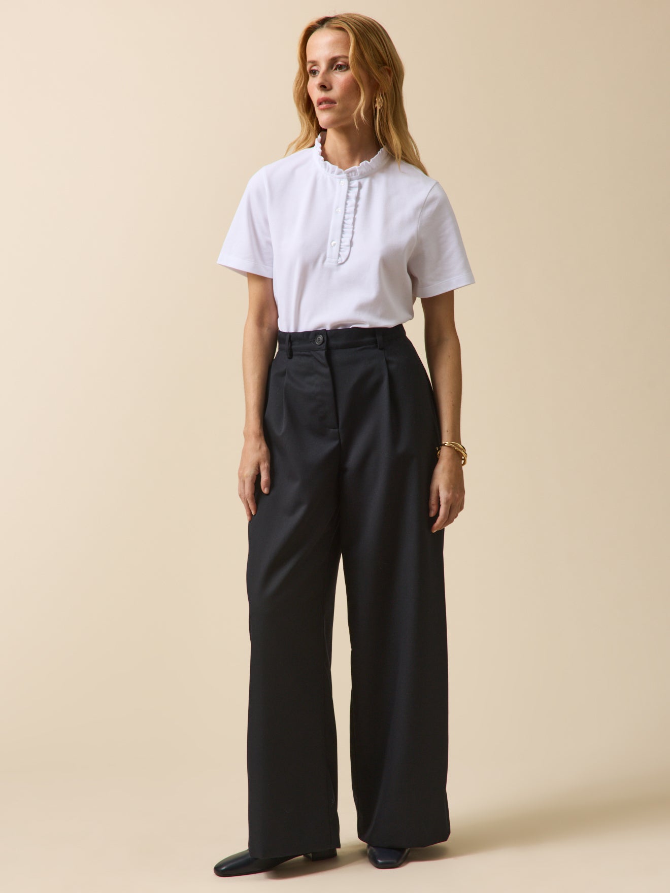 Polo maille piquée col volanté femme