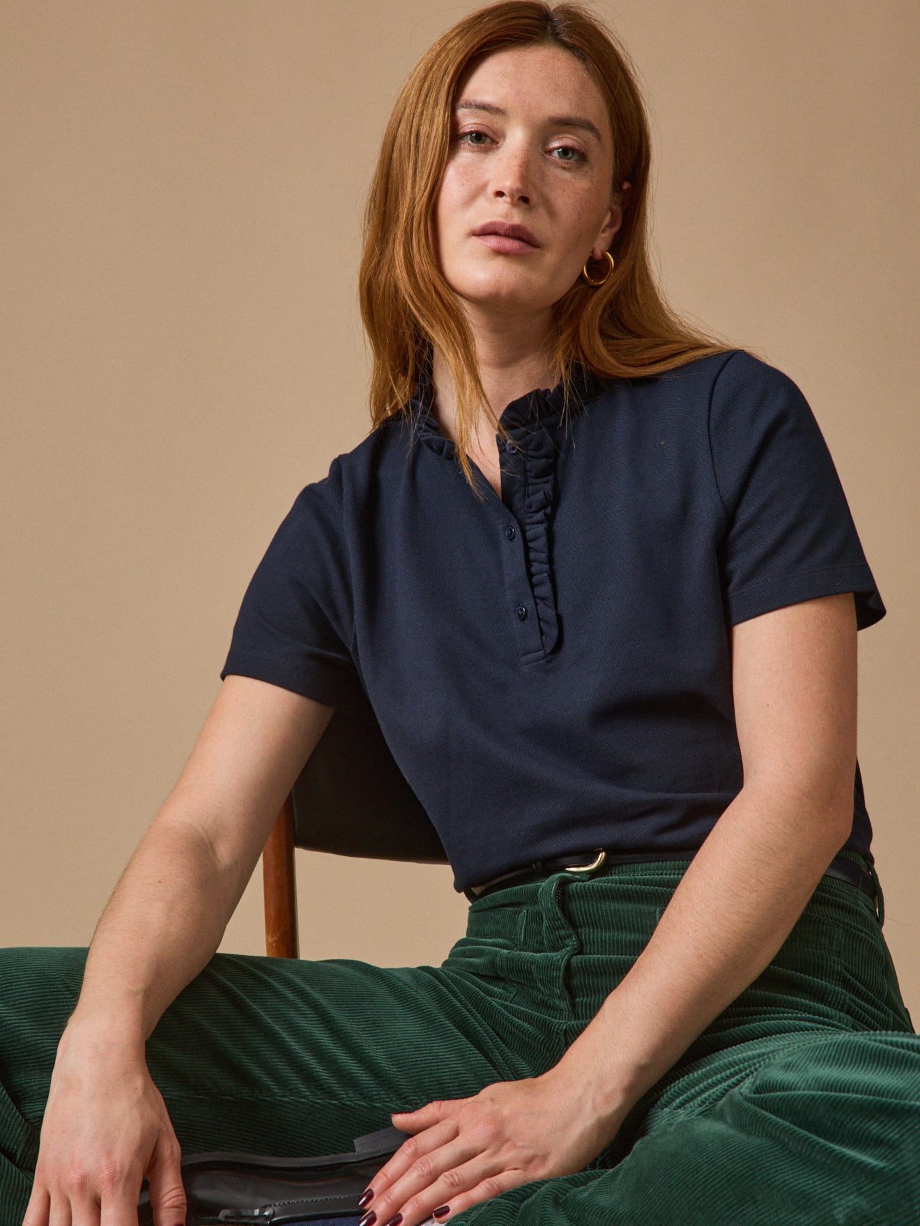 Polo maille piquée col volanté femme