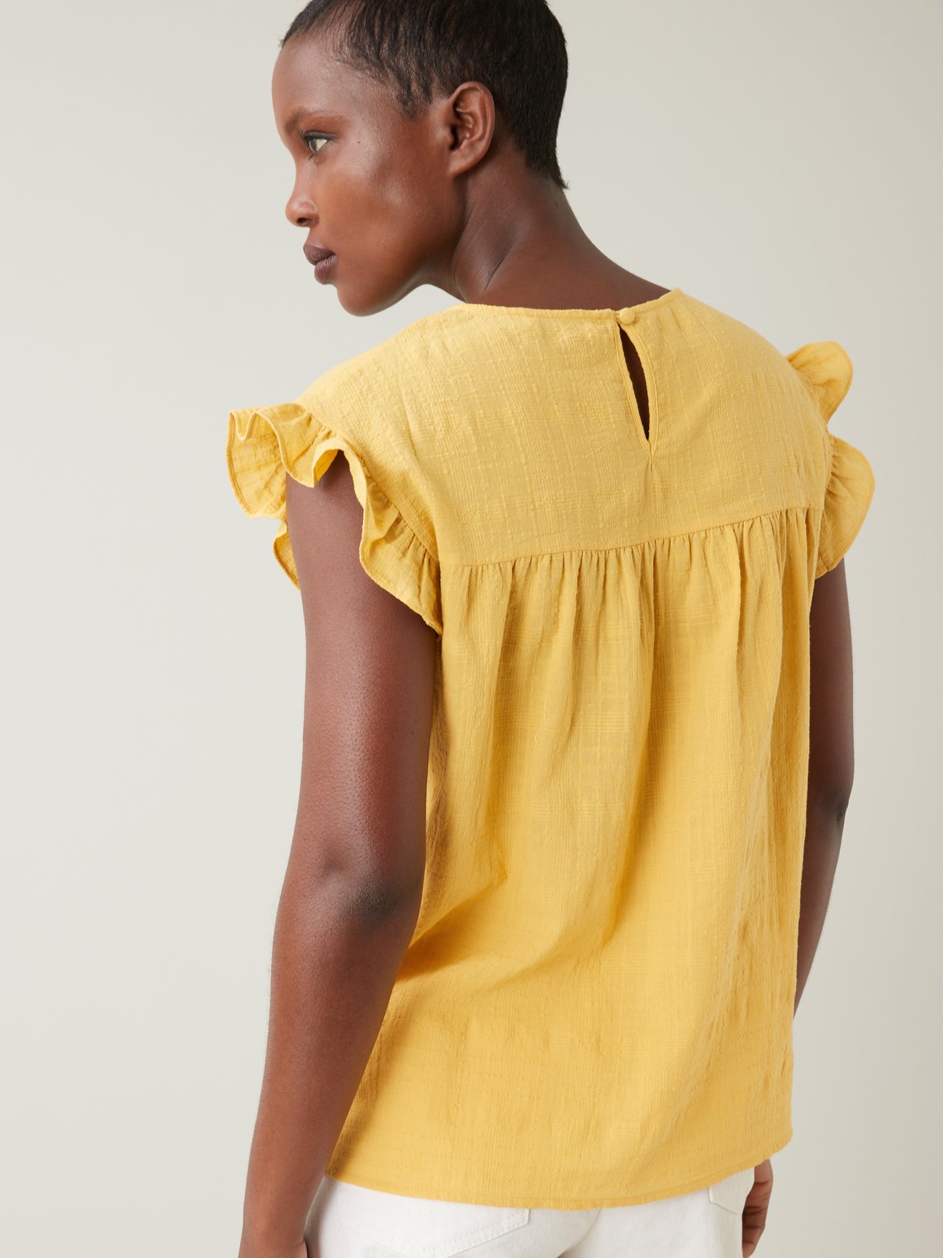 Top sans manches brodé et volanté femme